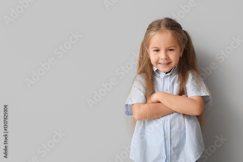 Happy little girl with cros...