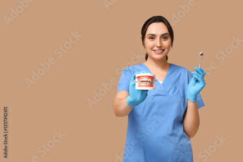 Young female dentist with j...