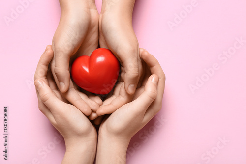 Hands of woman and child wi...