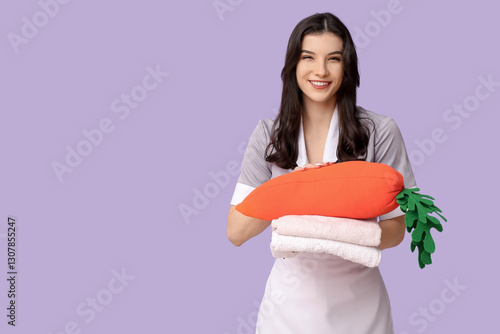 Happy female chambermaid wi...