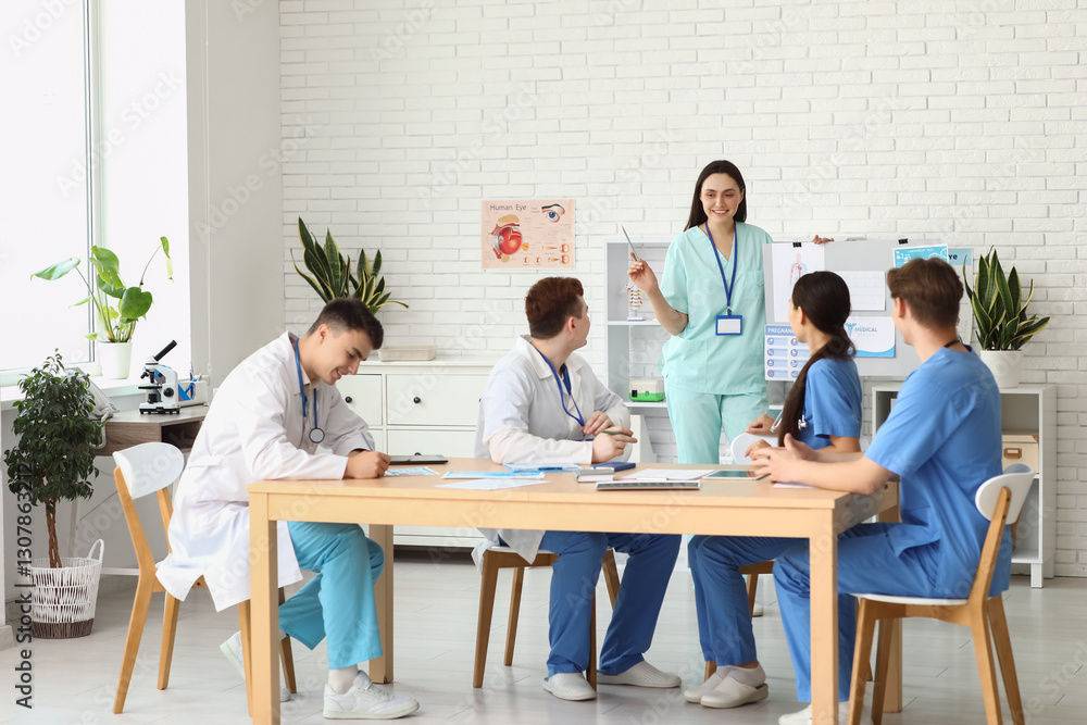 Female doctor working with her colleagues in clinic Female doctor working with her colleagues in clinic