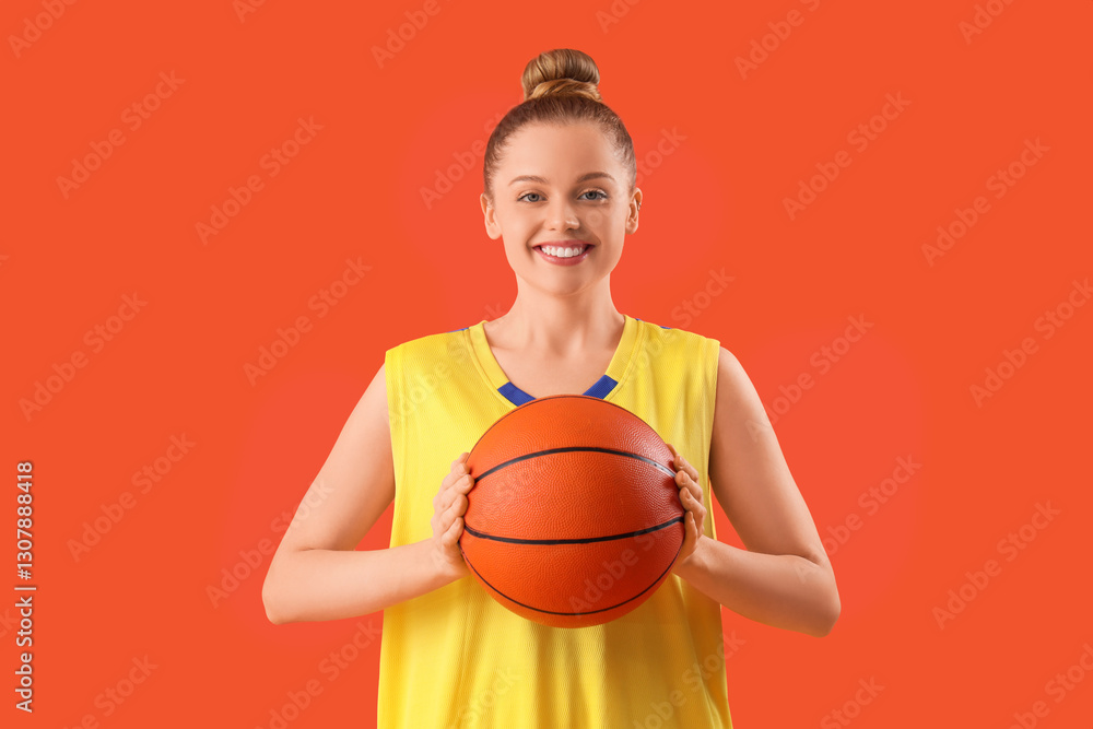 Sporty young woman with basketball ball on orange background Sporty young woman with basketball ball on orange background