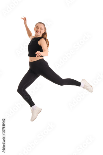 Sporty young woman jumping ...