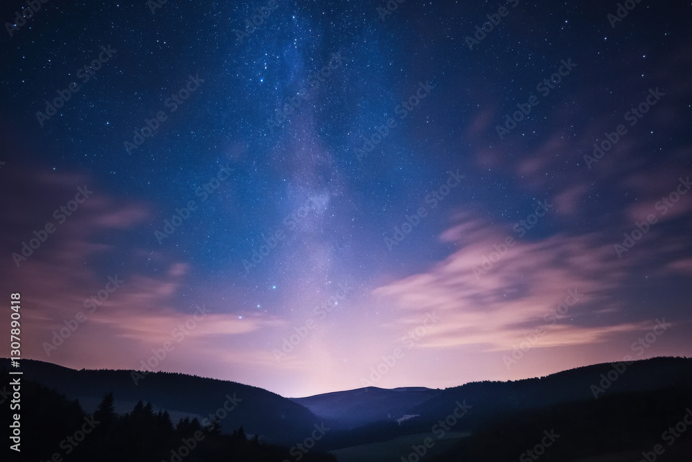 Fototapeta premium Majestic milky way galaxy shining over mountain landscape at night