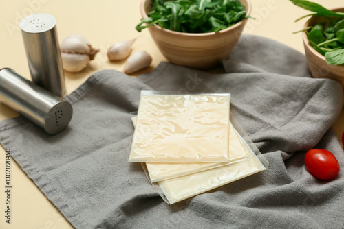 Packaged sliced cheese on g...