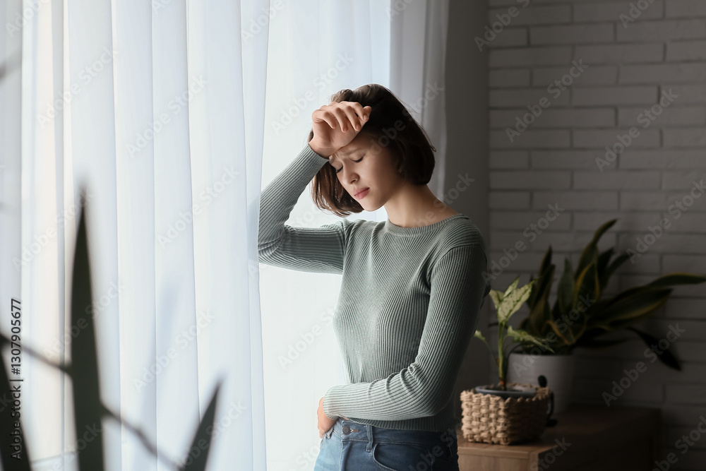Portrait of depressed young woman at home Portrait of depressed young woman at home