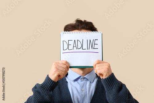 Man holding notebook with "...