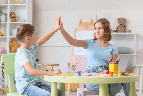 Kids giving each other high...