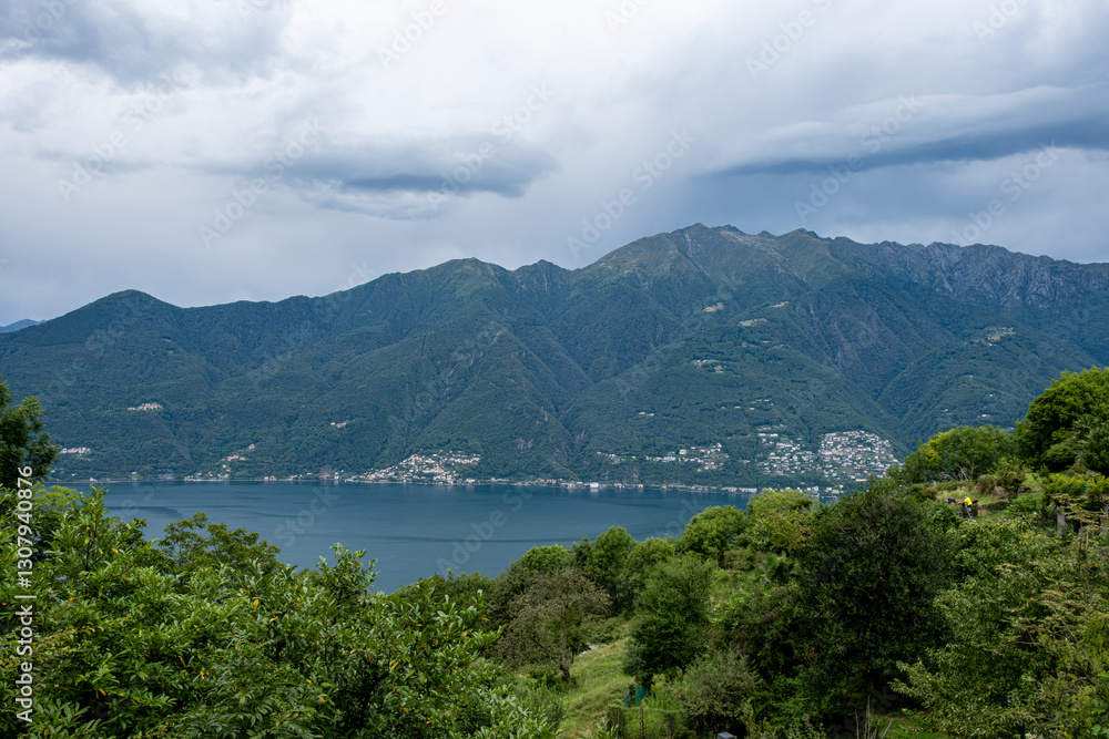 Scenic View over the Lago Maggiore in Italy with Ancona (Switzerland) and Mountains in the Background. Scenic View over the Lago Maggiore in Italy with Ancona (Switzerland) and Mountains in the Background.