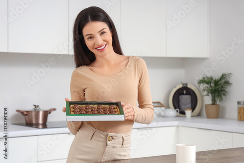 Smiling young woman with de...