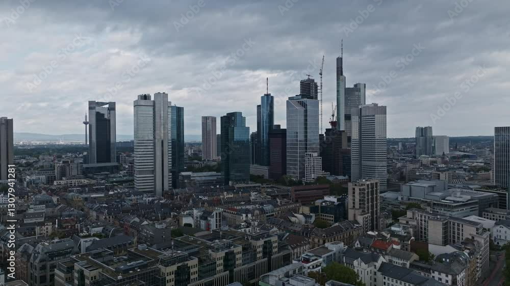 Aerial Drone View of Frankfurt’s Financial District with Modern Skyscrapers Rising Over Historic Rooftops . Aerial Drone View of Frankfurt’s Financial District with Modern Skyscrapers Rising Over Historic Rooftops .