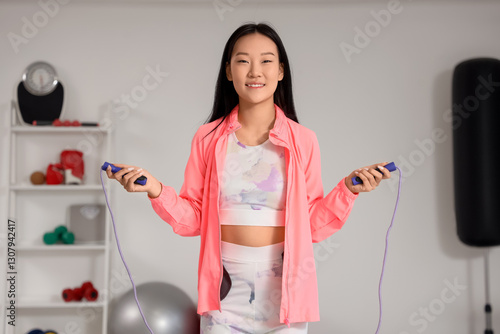 Young asian woman in active...