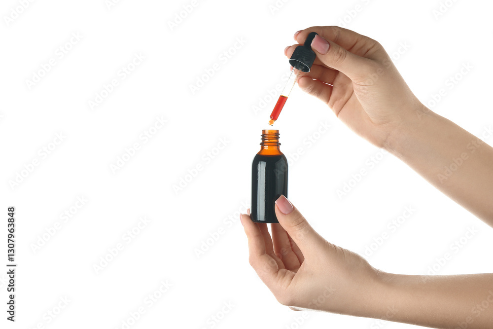 Female hands with bottle and pipette of iodine on white background. Closeup Female hands with bottle and pipette of iodine on white background. Closeup