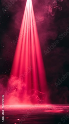 Dramatic red light beams pierce through smoky darkness at an evening event creating a captivating atmosphere