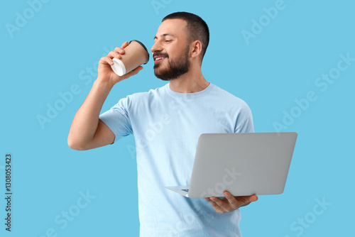 Young man with laptop and c...