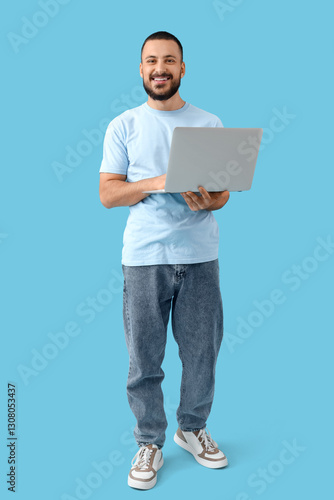 Smiling young man holding l...