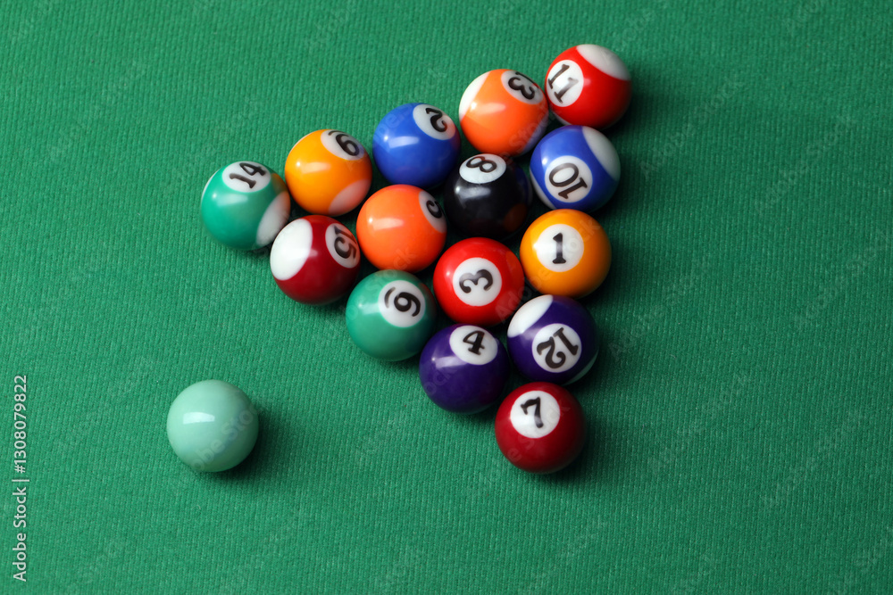 Billiard balls in triangle on green table, top view Billiard balls in triangle on green table, top view