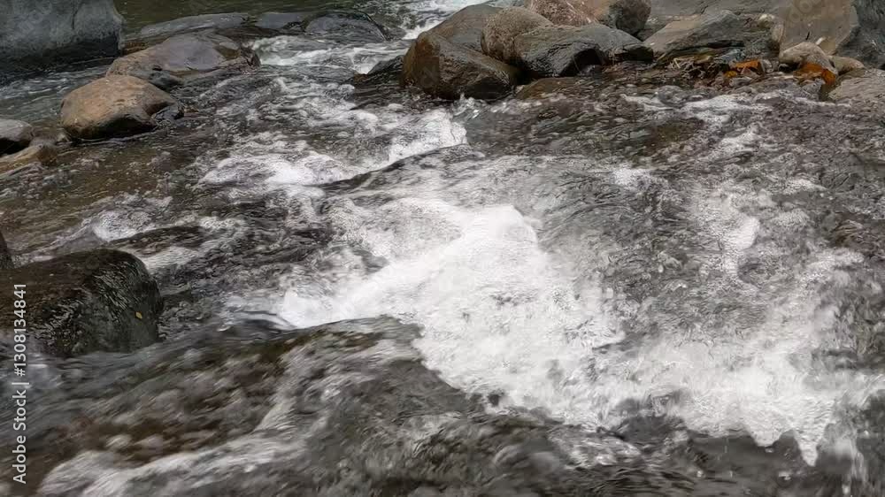 water flowing over rocks water flowing over rocks