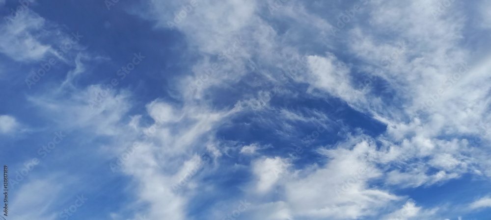 sky with swirling clouds in various shades of blue and white, creating a dynamic and captivating visual effect that evokes a sense of wonder. sky with swirling clouds in various shades of blue and white, creating a dynamic and captivating visual effect that evokes a sense of wonder.