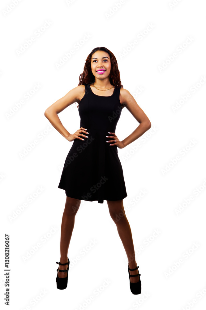 Attractive Hispanic Woman Standing In Black Dress Arms Akimbo Attractive Hispanic Woman Standing In Black Dress Arms Akimbo