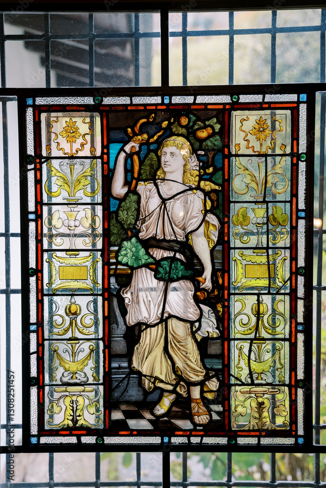 Obraz premium Stained glass mosaic window depicting an ancient goddess