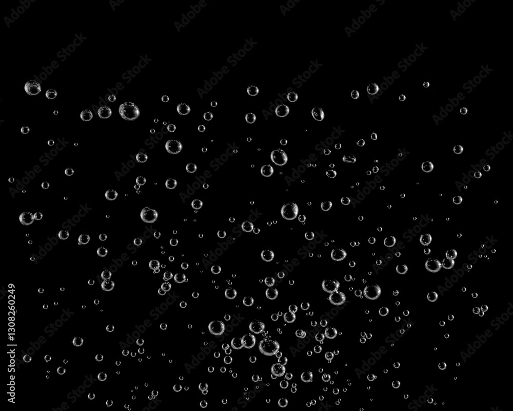 Underwater bubbles, Underwater oxygen design concept, Small water drops underwater, On black background, Close-up photography. Underwater bubbles, Underwater oxygen design concept, Small water drops underwater, On black background, Close-up photography.