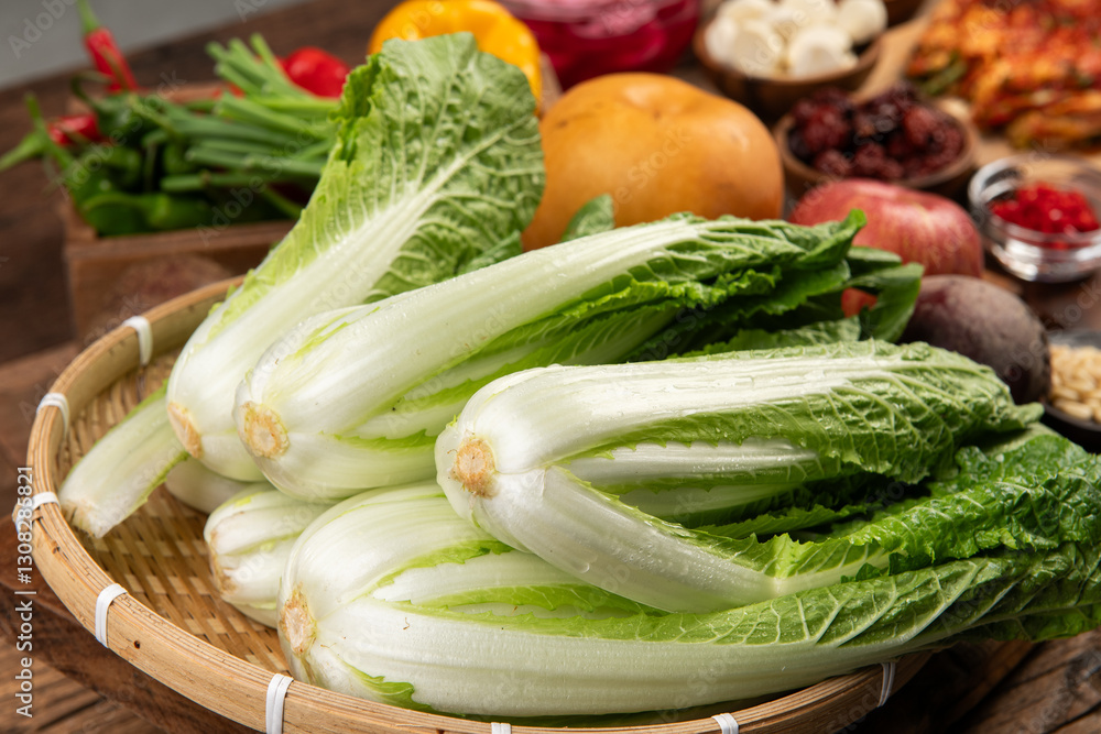 chinese cabbage in a basket on wooden table, close-up chinese cabbage in a basket on wooden table, close-up