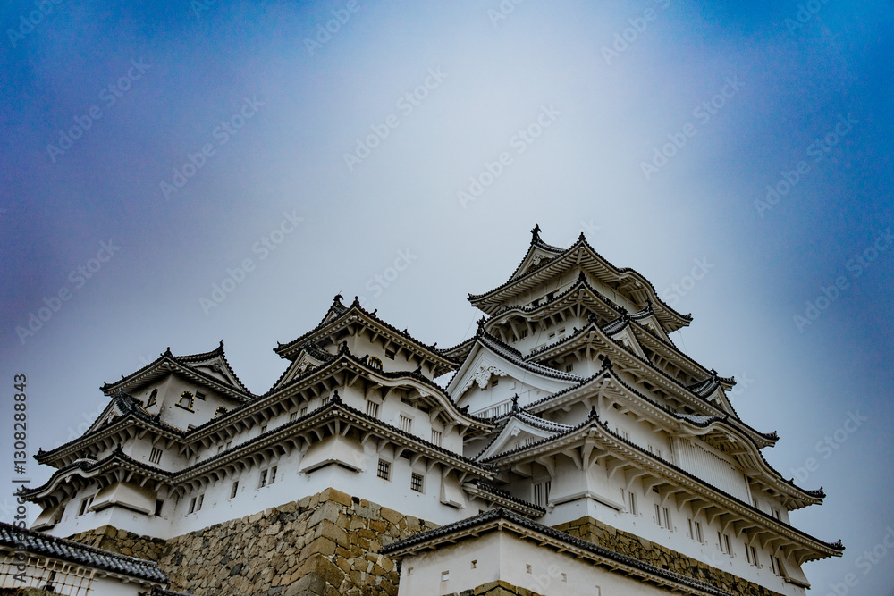 Himeji Castle in Japan under blue sky and white clouds Himeji Castle in Japan under blue sky and white clouds