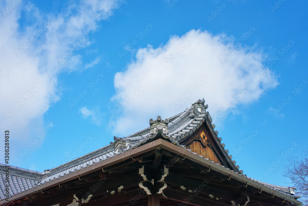 Auspicious clouds over the eaves of the ancient temple in Kyoto, Japan Auspicious clouds over the eaves of the ancient temple in Kyoto, Japan