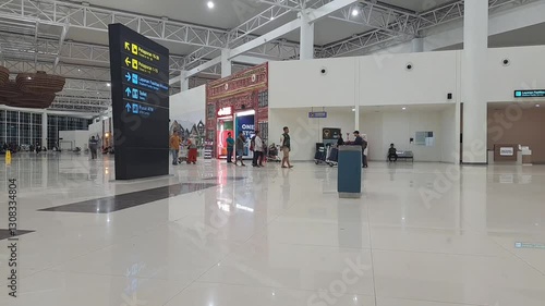 Wallpaper Mural Banjarmasin,indonesia february 25th 2025 : a directional sign at an airport, providing information about gates, restrooms, baggage claim, and other facilities to help passengers navigate efficiently Torontodigital.ca