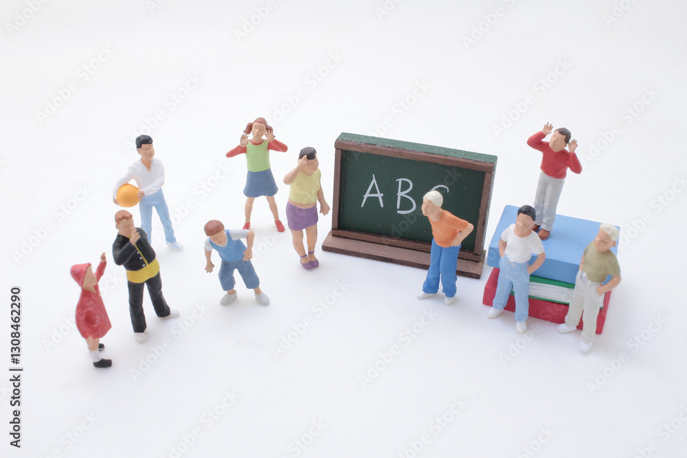 A Miniature Figures with Chalkboard Illustrating Education A Miniature Figures with Chalkboard Illustrating Education