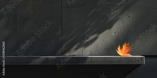 Obraz na płótnie Autumnal Leaf on Dark Wall - A Minimalist Scene w salonie