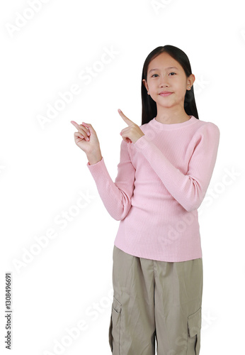 Obraz na płótnie Portrait of Asian girl child point both index finger up on empty space and looking camera isolated on white background. Image half length, Advertising concept. w salonie
