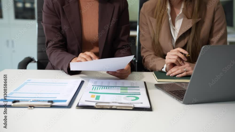 Business team to calculate financial information to invest in new projects. financial manager meeting.euing Smart phone and laptop and digital tablet PCs in office. Business team to calculate financial information to invest in new projects. financial manager meeting.euing Smart phone and laptop and digital tablet PCs in office.