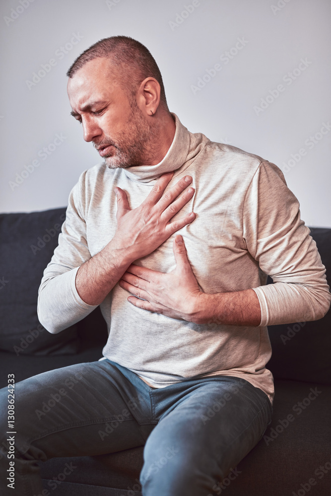 Man with gastritis, chest and abdominal pain at home. Man with gastritis, chest and abdominal pain at home.