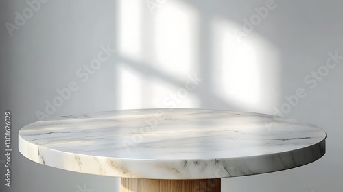 Round marble table top with abstract shadows on white wall background. Minimalist mockup for product display and presentation.