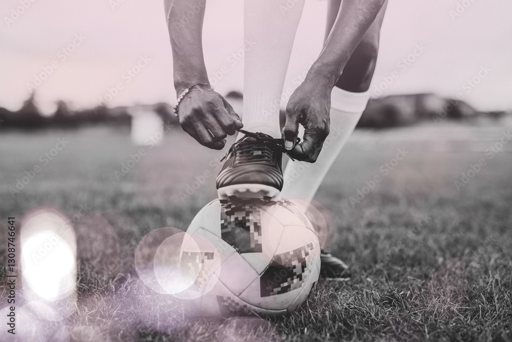 Fototapeta premium Football player tying her shoelaces