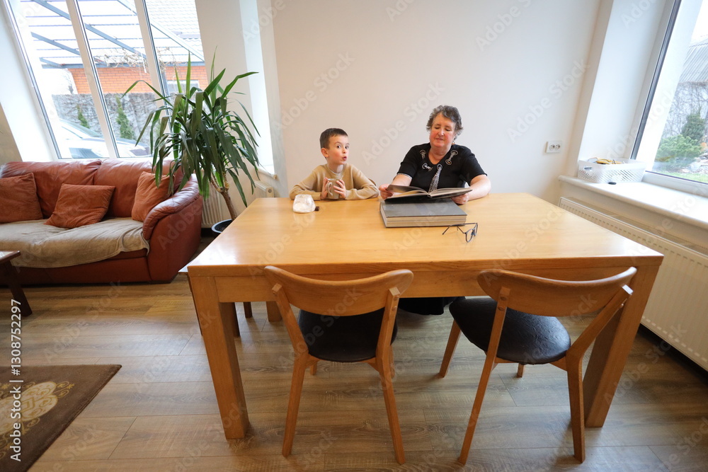 Fototapeta premium Grandmother and grandson talking indoors