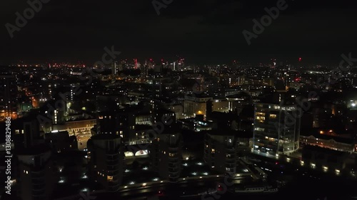 Wallpaper Mural Aerial view rising over the cityscape of Limehouse, night in London, England Torontodigital.ca