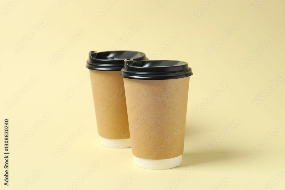 Paper cups with plastic lid on light background. Coffee to go
