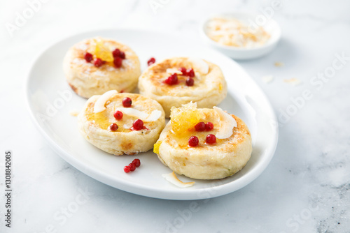 Homemade curd cakes with honey and coconut