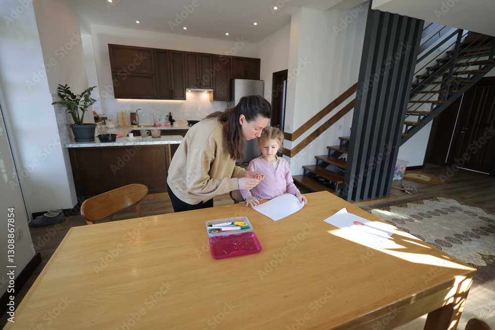 Mother and a daughter indoors spending time together Mother and a daughter indoors spending time together