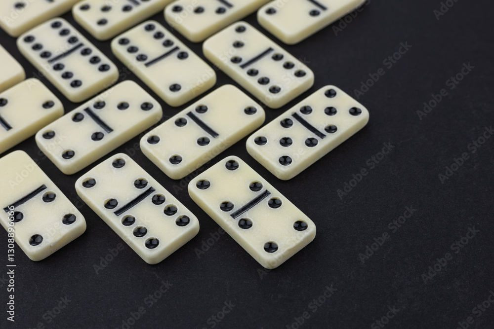 Flat lay composition of chess pieces and dominoes on dark table Flat lay composition of chess pieces and dominoes on dark table