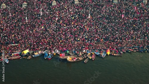 Aerial view of Huge crowd at Triveni Sangam in Prayagraj, India during Maha Kumbh. Kumbh Mela is the most important event, where millions of devotees, including Sadhu take a sacred holy dip in Ganga.