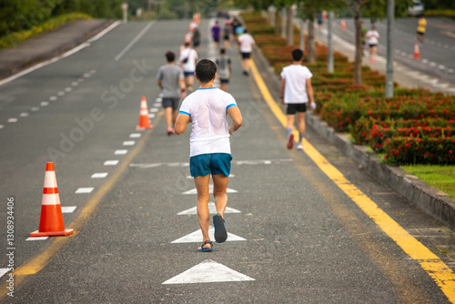 man  exercising running, walking in a park with a group of people