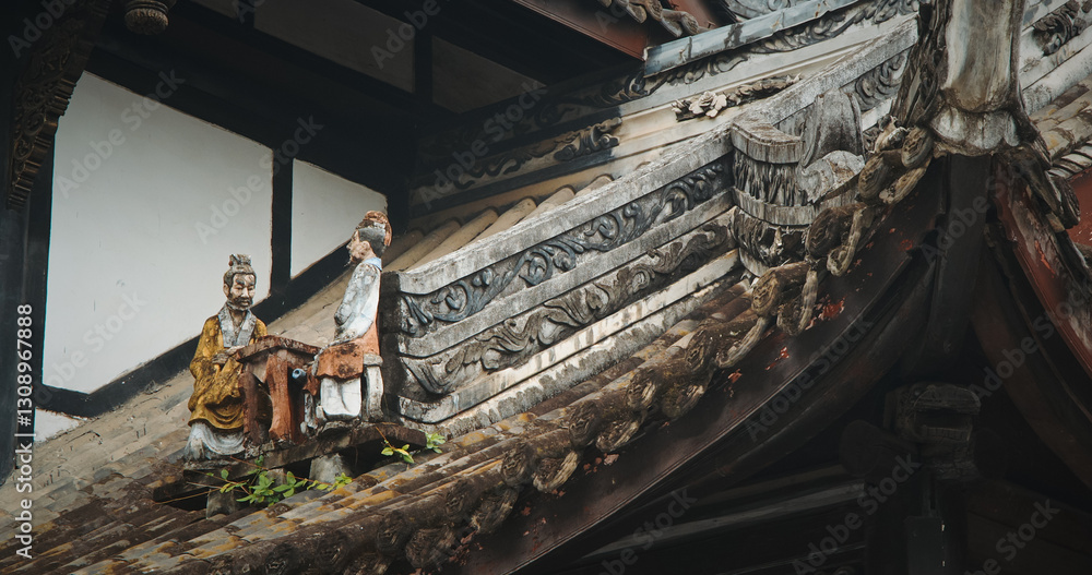 Chengdu, Sichuan, China. Figurines On Roof Of Temple. Chinese Architecture. Figurine Of Men Sitting At Table. Park On Grounds Of Wuhou Memorial Temple, Chengdu. Traditional Chinese Architectural