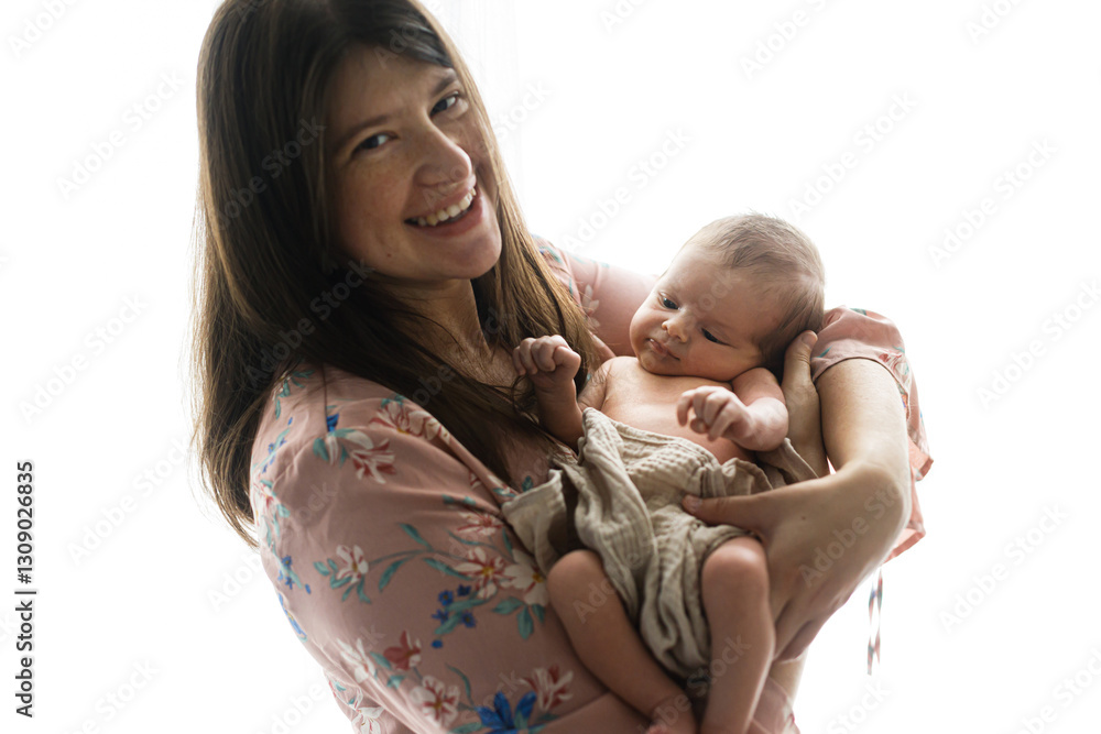 Happy Mothers day! Stylish Mother holding and hugging cute newborn baby in window light, close up. Motherhood and parenthood. Adoption and fertility concept Happy Mothers day! Stylish Mother holding and hugging cute newborn baby in window light, close up. Motherhood and parenthood. Adoption and fertility concept
