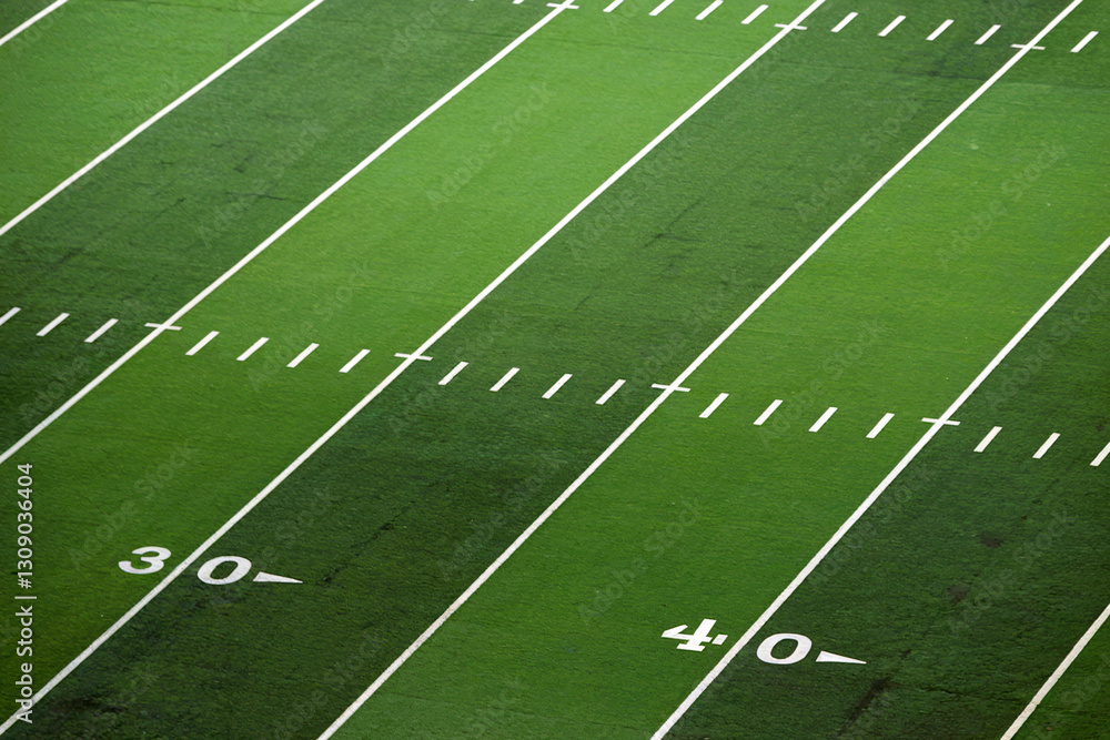 Green American Football Field Marked with White Yard Lines Green American Football Field Marked with White Yard Lines