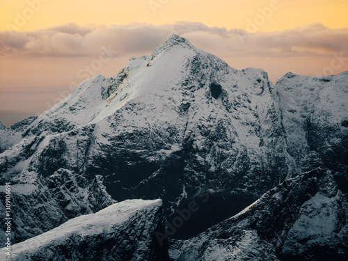 Canvastavla A Majestic SnowCapped Mountain Embraced by the Warm Glow of Sunrise in All Its G