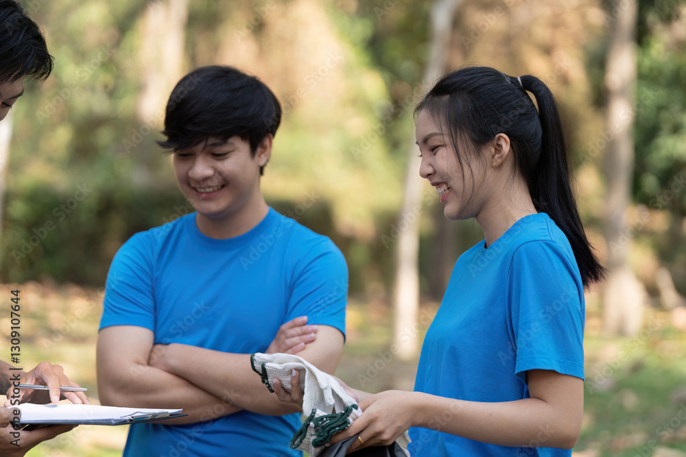 Obraz premium Sustainable volunteering. Young adults engaging in community service to promote environmental sustainability.
